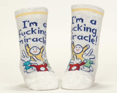 I'm A Fucking Miracle!/ Binge Watch Me Baby Socks Socks Blue Q  Paper Skyscraper Gift Shop Charlotte