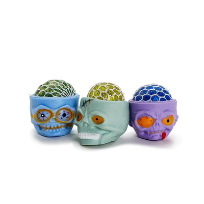 Skull Squeezie | Glitter Gel Skull Unit - Rubber | Assorted Holiday Two's Company  Paper Skyscraper Gift Shop Charlotte