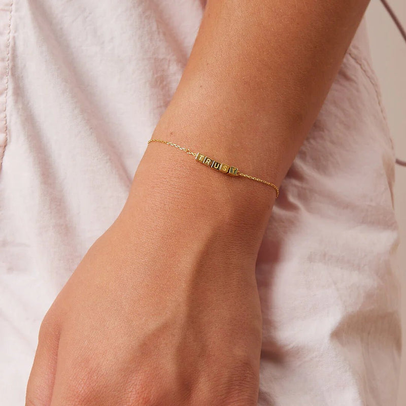 Tiny Words Trust Bracelet - Little layers 14k Gold  Little Words Project  Paper Skyscraper Gift Shop Charlotte